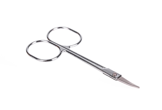 A metal brow scissors isolated on a white background.