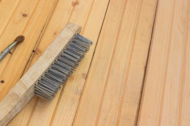 Metal brush for repair on the wooden floor