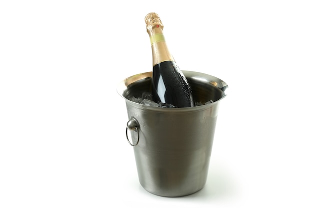 Metal bucket with ice and Champagne bottle isolated on white background.
