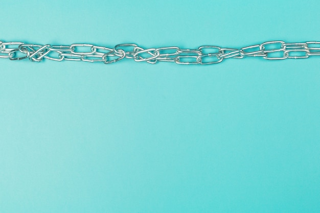 Metal chain isolated on blue background