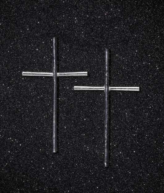 Photo metal christian cross on a black background