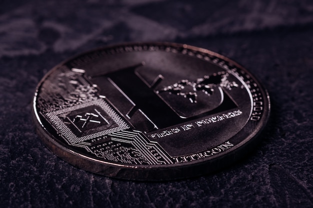 Photo metal coin of crypto currency litecoin close up