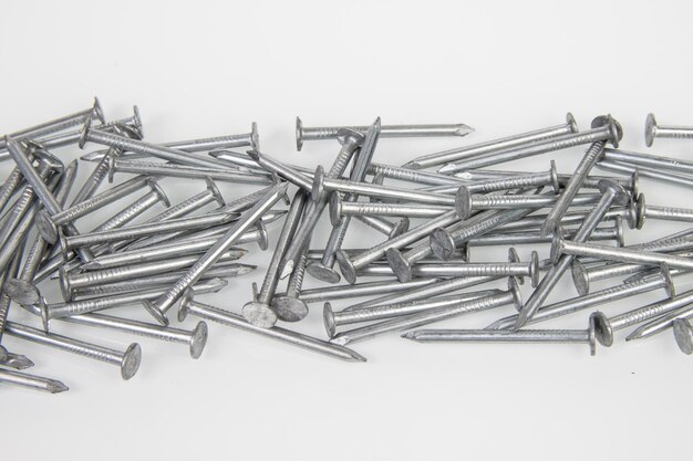 Metal construction nails on a white background