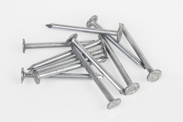 Metal construction nails on a white background