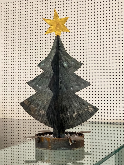Photo metal decorative christmas tree with a star on top