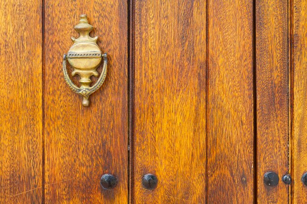 Metal detail of an old wooden door closeup