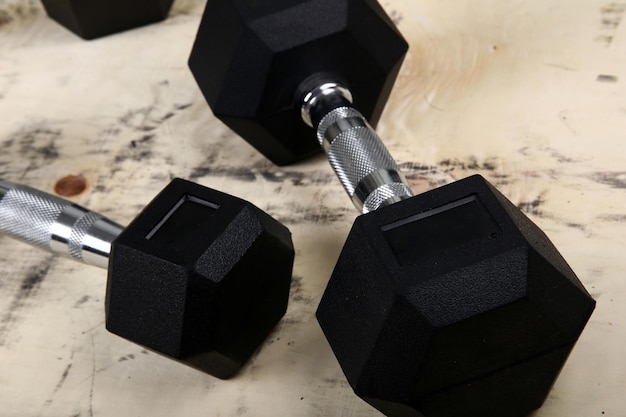 The metal dumbbells on the floor.