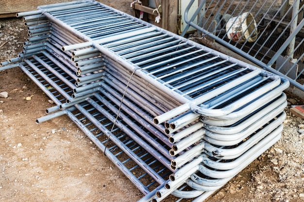 Metal fences are folded at the construction site, prepared for installation. Pirila for installation in a residential building.