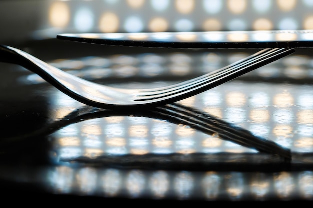 Metal forks and knives on a plate