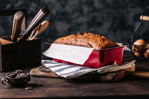 Metal form with baked bread loaf