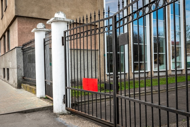 Metal gates in front of the administrative building.