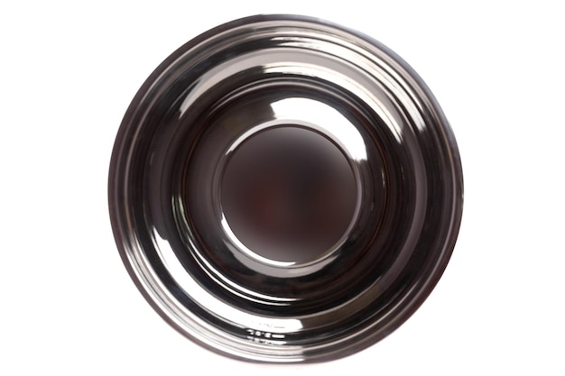 Metal glossy bowl on white background top view