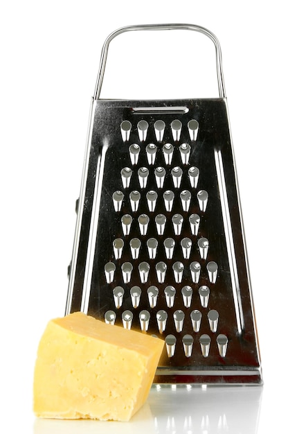 Metal grater and cheese isolated on white