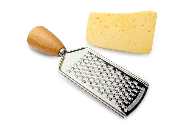 metal grater with a wooden handle and a piece of hard cheese on white