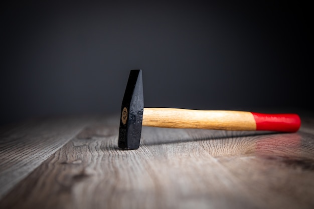 metal hammer on the wooden surface