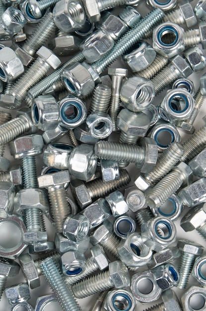 Metal hardware bolts and nuts. View from above