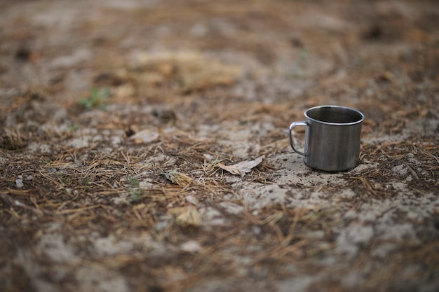 metal hiking mug in the woods Titan metal mug Hike in the woods Tea or coffee time while adventur