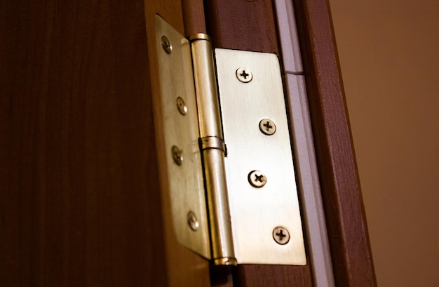 Metal hinge on a wooden entrance door interior door hinge