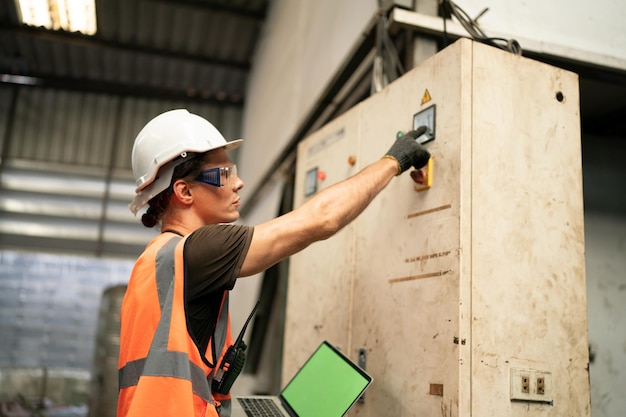 Metal industry worker at factory in work wear