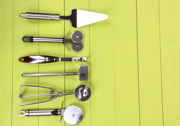 Photo metal kitchen utensils on table closeup