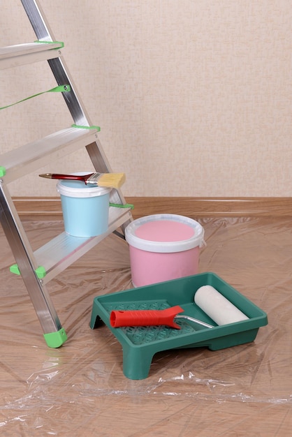 Metal ladder and paint in room