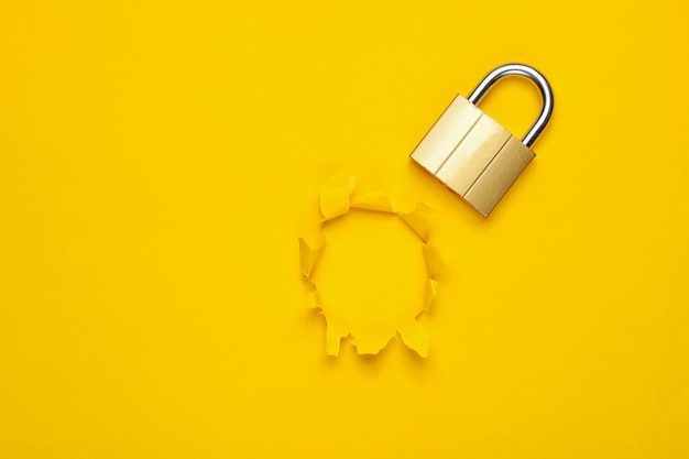 Photo metal lock isolated on yellow