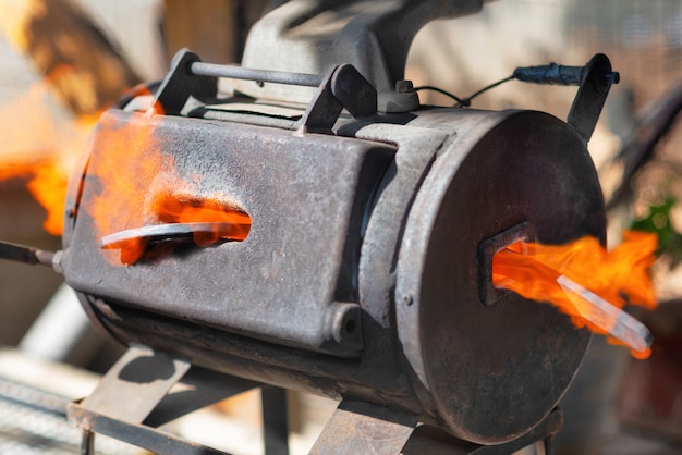 Metal melting in a small portable forge.