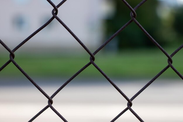 Metal mesh on the background of the road