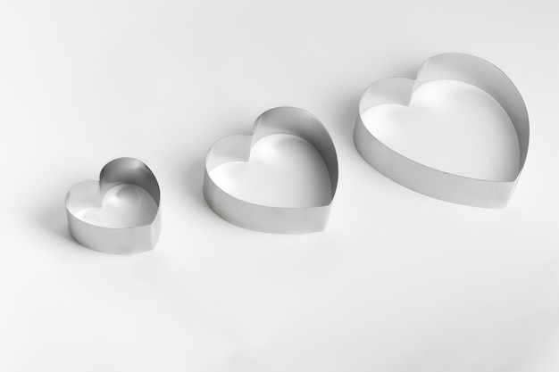 Metal mold in the form of heart on a white