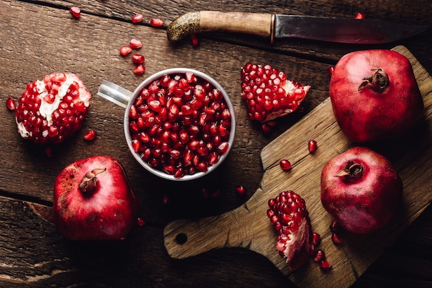 Metal mug full of pomegranate seeds