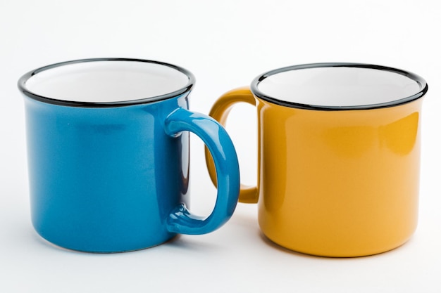 Metal mugs on a white isolated background