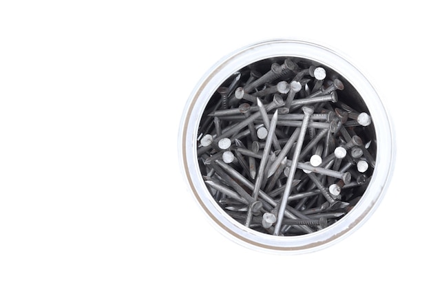 Metal nails in a jar top view white background space for text