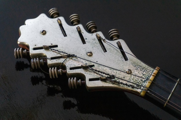 Metal neck of an old banjo instrument