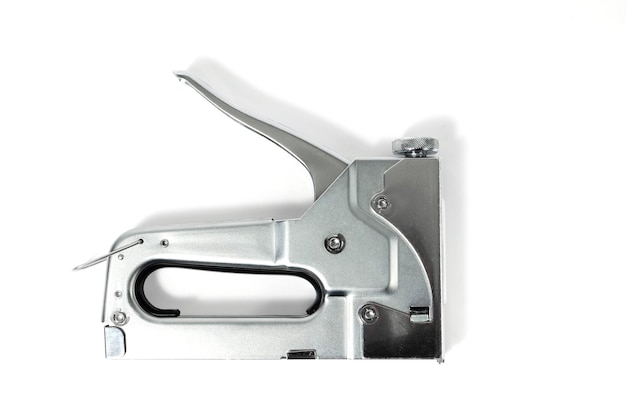 Metal Nickel plated stapler gun on white background isolate close up