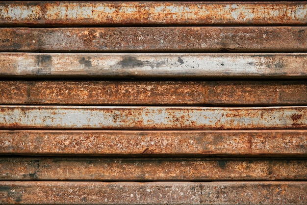 Photo metal old rusty background a stack of iron profiles grunge style