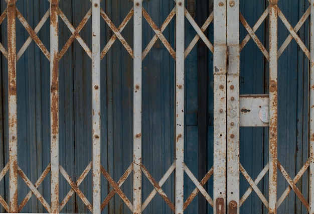 Metal old rusty handle on wooden door