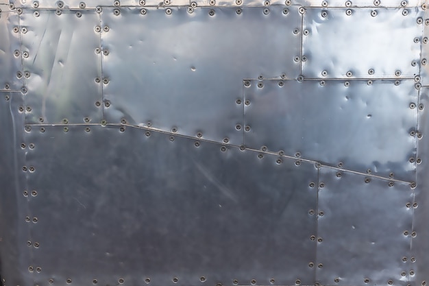 Metal panel with screws