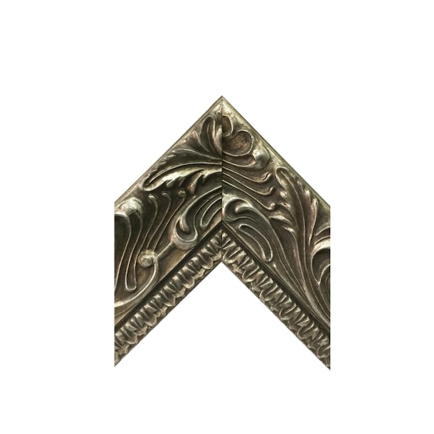 A metal piece with a wave design on the top.