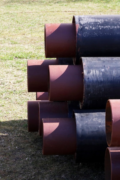 Metal pipes for water pipes folded on the grass