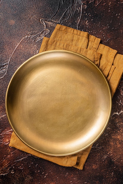 Metal plate on table Food cooking and healthy eating background Dark background Top view Copy space