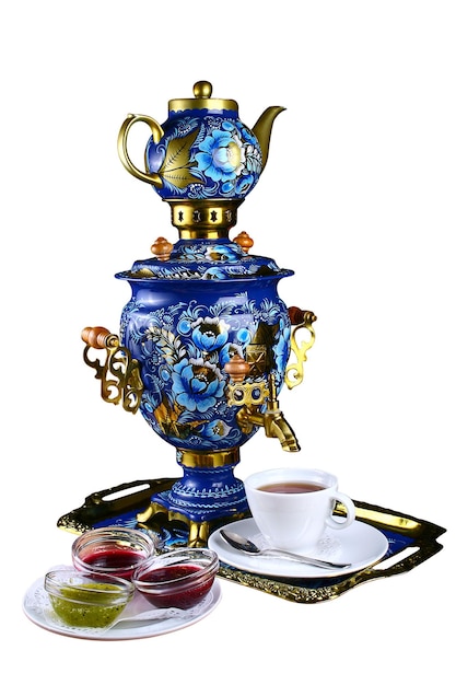 metal russian samovar with traditional ornaments and paintings on a white background