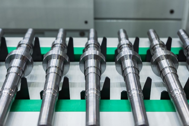 Metal shafts on the CNC conveyor transfer belt