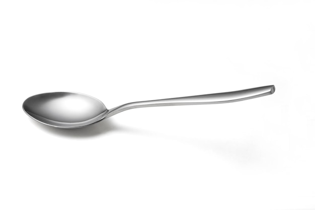 the metal shiny spoon isolated on white
