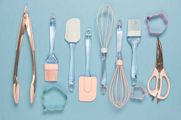 Metal and silicone kitchen utensils in pink color