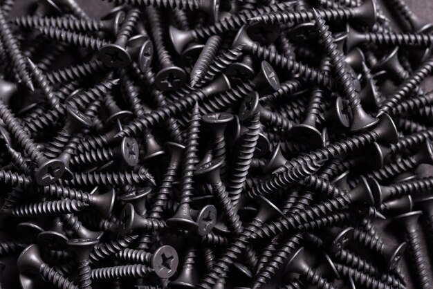 Metal Stainless Steel Self Tapping Screws on black wooden background