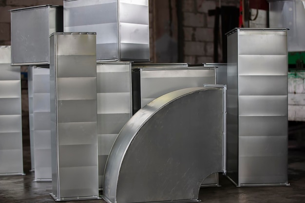 Metal stainless ventilation pipes at a metallurgical plant Rolled metal