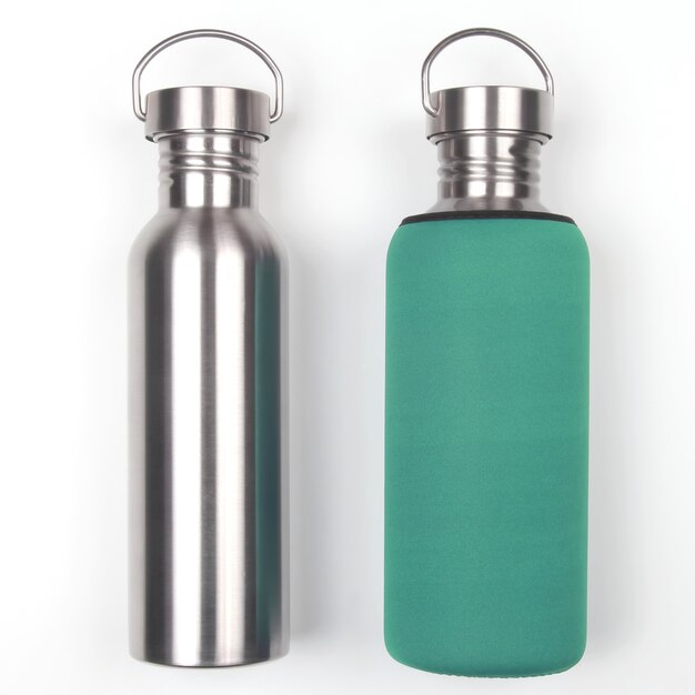 Photo metal steel water flasks on white background. everyday items