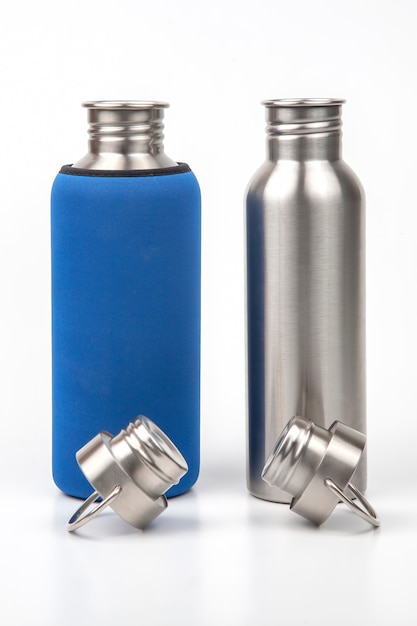 Metal steel water flasks on white. metal drinking utensils
