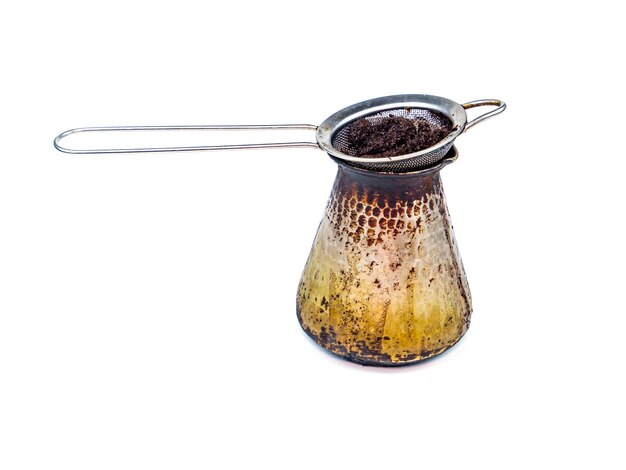 Metal strainer for coffee and tea on a white background