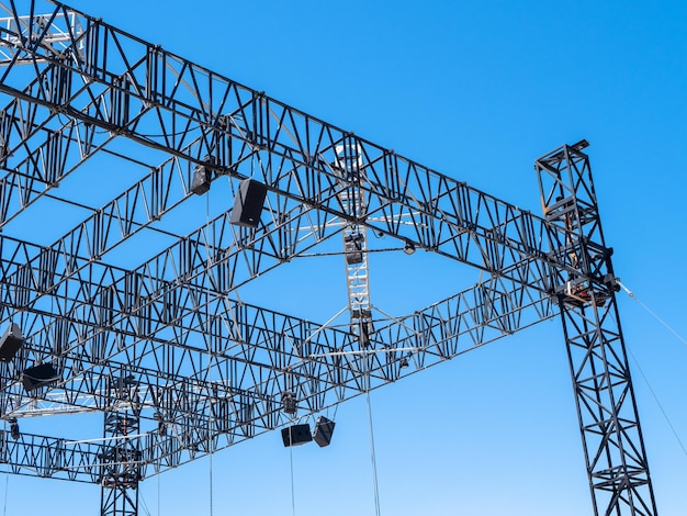 Metal structures assembled into a scene against a blue sky